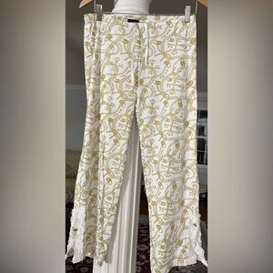 Baby phat women’s 100% cotton pants crame and shiny gold . Chain , logo print